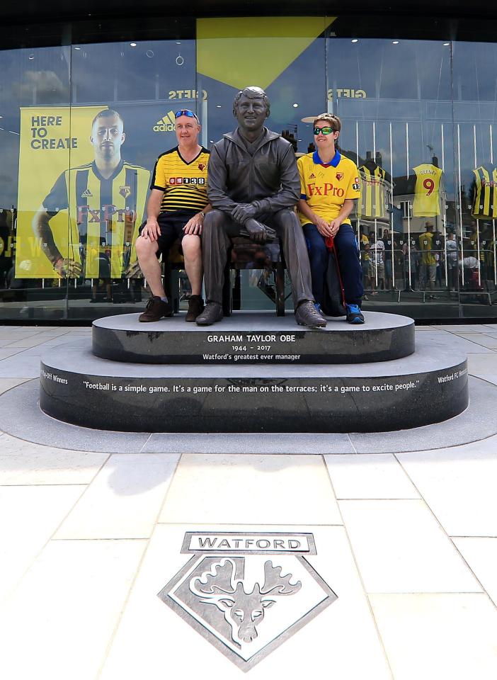  Fans posed with the statue of "Watford's greatest ever manager"