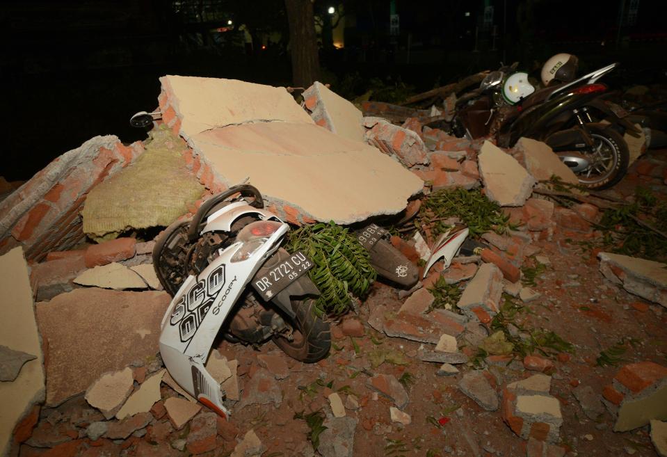  Parts of a shopping mall building collapsed after an earthquake was felt in Denpasar