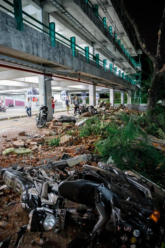  Parts of a shopping mall building collapsed after an earthquake was felt in Denpasar