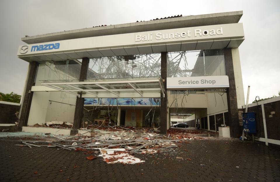  Debris is seen at a Mazda auto shop in Denpasar, on Indonesia's resort island of Bali