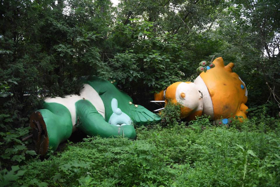 The severed mascots hide in the now overgrown jungle that is the Olympic village