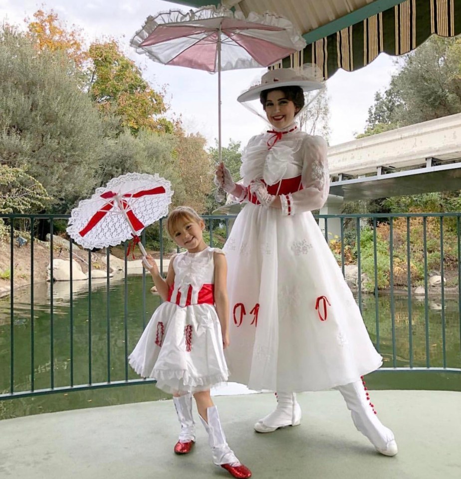 Mother and daughter dressed up as matching Mary Poppins characters for a day at the park