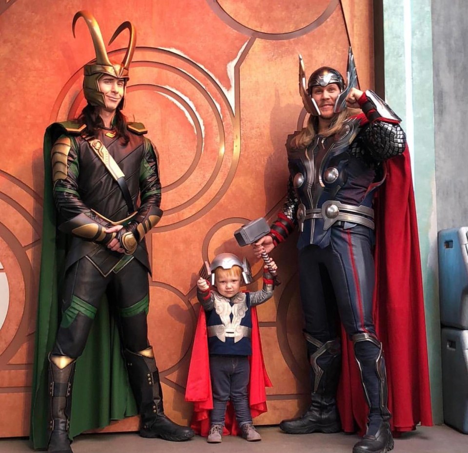 Liam poses with characters from Thor and the Avengers