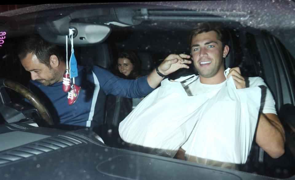  Dani, 22, looked on proudly as the pair juggled with the food bags in the front of the car