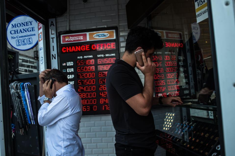  People check currency exchange rates at a currency exchange office in Istanbulal