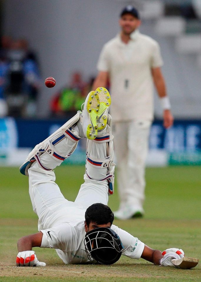 India's Ravichandran Ashwin dives back to his crease as England's Jonny Bairstow attempts to take his wicket