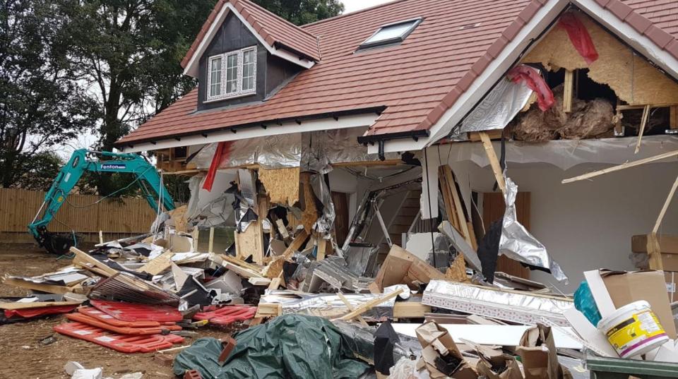 A man has been charged over the damaged homes