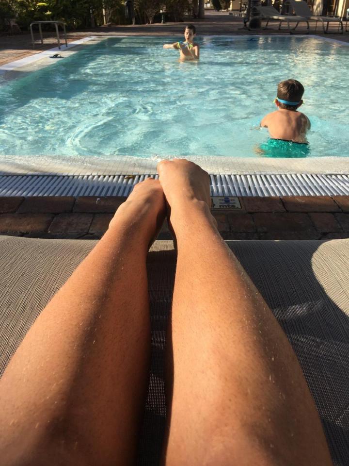  Stacey shows off her hairy legs while on holiday with her sons earlier this year