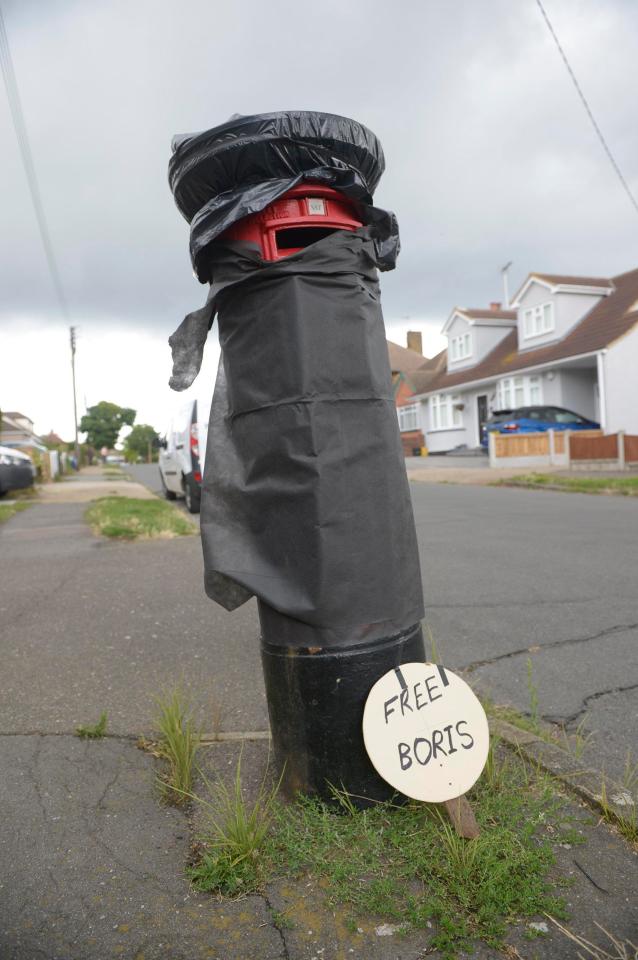  This postbox draped in a black bin bag also bears a sign supporting Boris Johnson