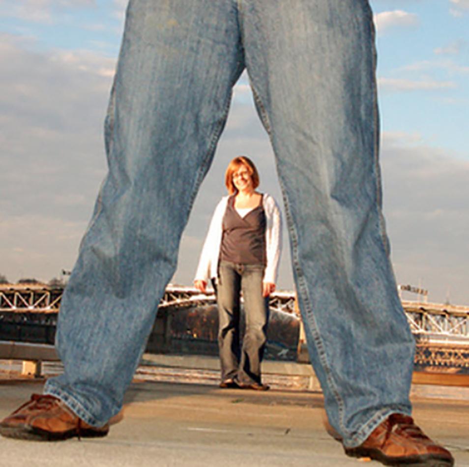  In one odd shot, a bride appears to be framed by her partner's legs