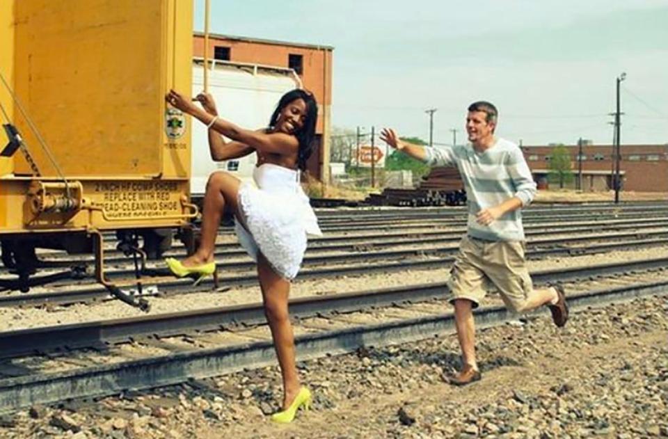  A bride-to-be attempts a getaway from her fiance in this take on an engagement photo