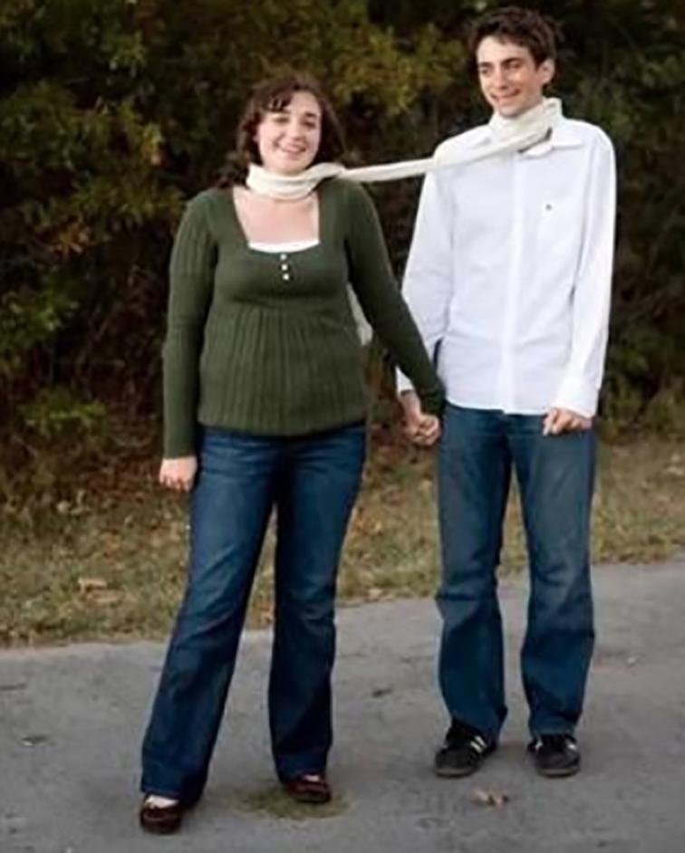  This couple appears to take their 'together forever' vows seriously with a shared scarf