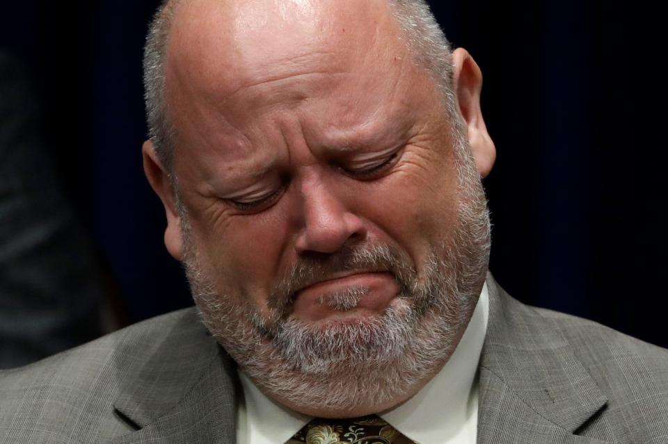  Former priest James Faluszczak, who says he was molested by a priest as a teenager, reacts as Pennsylvania Attorney General Josh Shapiro speaks during the news conference