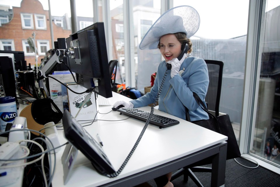 Lauren rocked the powder blue outfit at her desk – taking calls and answering emails in the regal attire