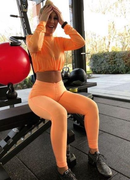 Kate Wright wears fluorescent orange at the gym