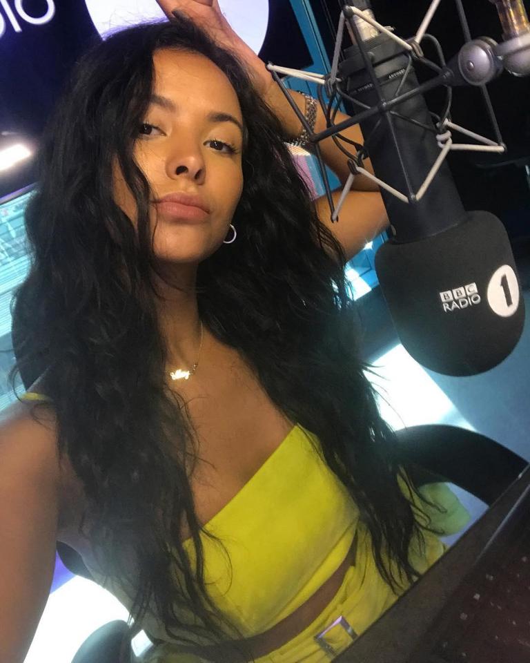 Maya Jama poses in a yellow co-ord while hard at work on BBC Radio 1