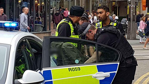  Dozens of police officers swarmed the Bullring shopping centre following reports teenagers were carrying firearms