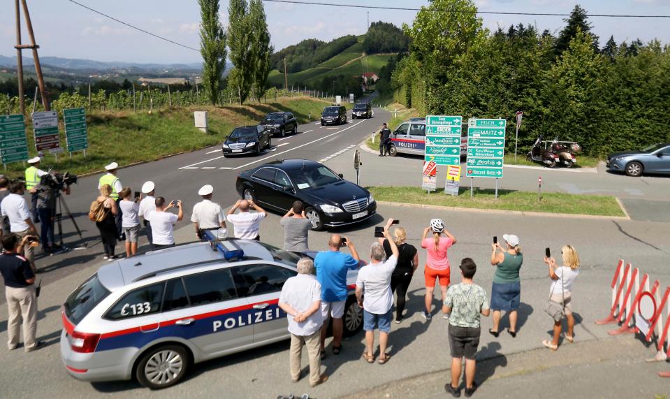  The heavily guarded motorcade arrives