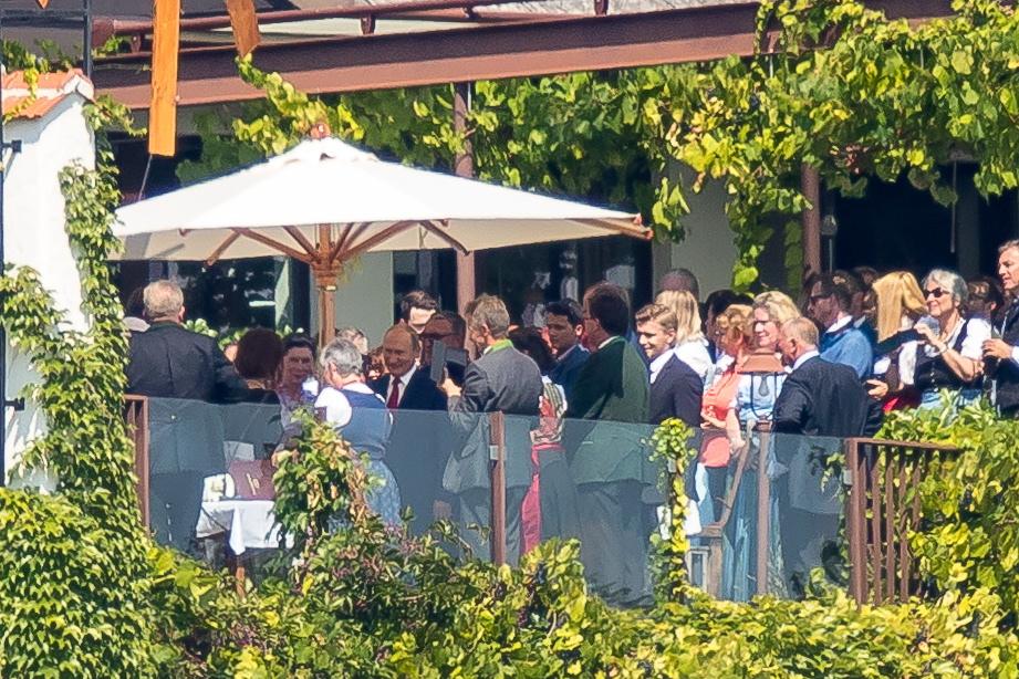  Welcome... Putin can be seen here mingling with guests