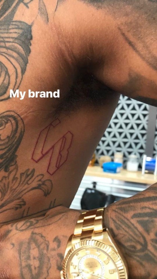 Conor Benn has had his branded initials tattooed on his torso