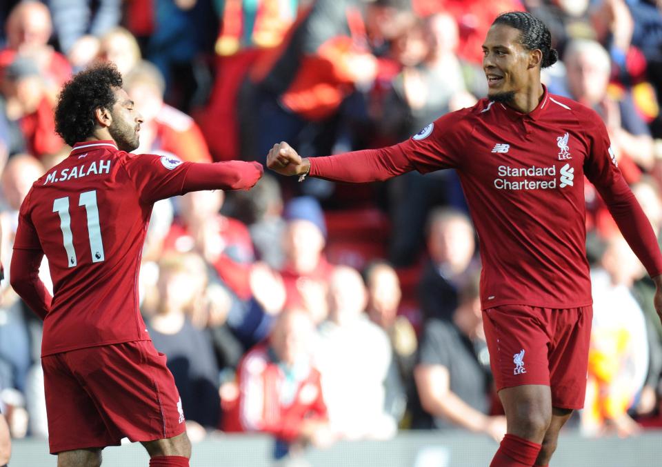  Mo Salah celebrates his winner against Brighton with Virgil van Dijk