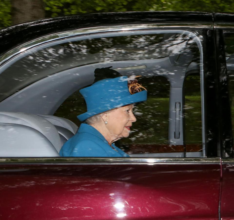  Her Majesty flashes a glorious smile as she is driven to church