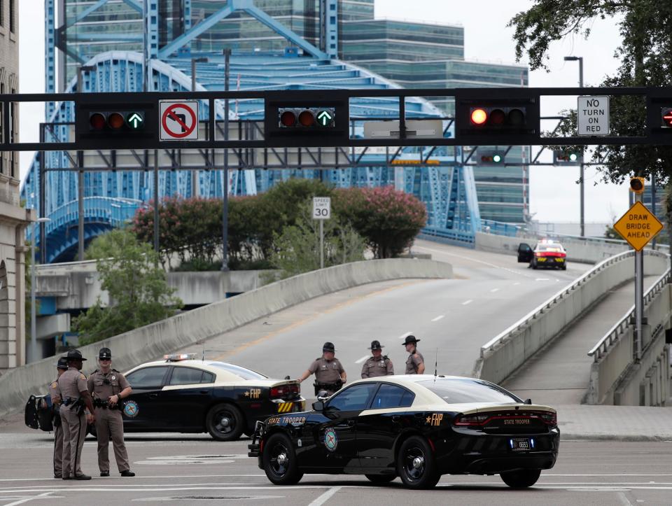  Roads surrounding the scene were closed off to traffic as the shopping mall was put in lockdown amid reports of a mass shooting and initial fears a gunman was on the loose