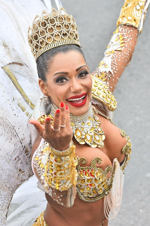  A performer smiles for the camera at the final day of the event