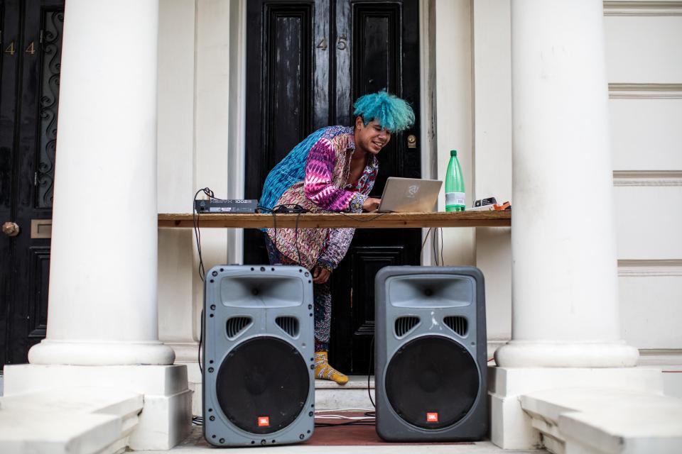  A DJ plays music from outside a house on the final day of the Notting Hill Carnival