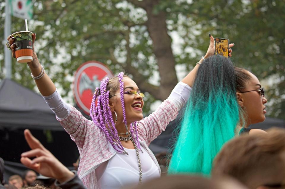  Rita Ora joined revellers as she got into the spirit of the festivities sporting lilac hair