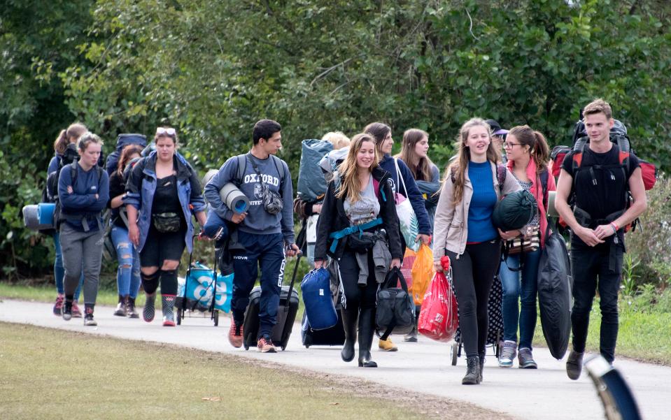  People poured in by the thousands to the Reading Festival campsite carrying large amounts of camping gear