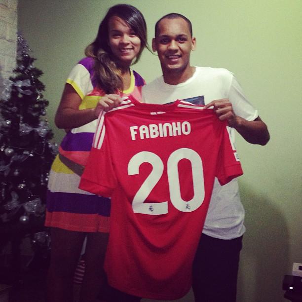 Fabinho holds aloft his Liverpool shirt - but he is yet to wear it in a competitive match