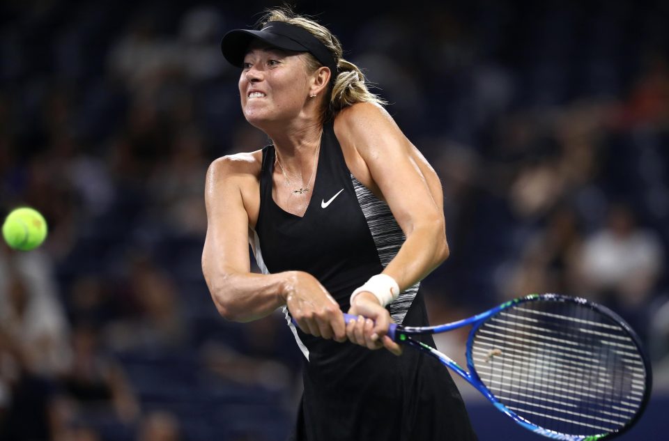  Maria Sharapova returns the ball during her women's singles first round match against Patty Schnyder