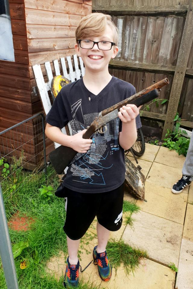  The youngster poses with the weapon at home as his family were unaware that it was loaded