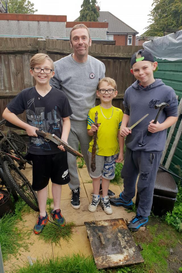  Dad Scott, 42, with McKenzie and his two other sons, recognised the weapon from his days in a rifling club