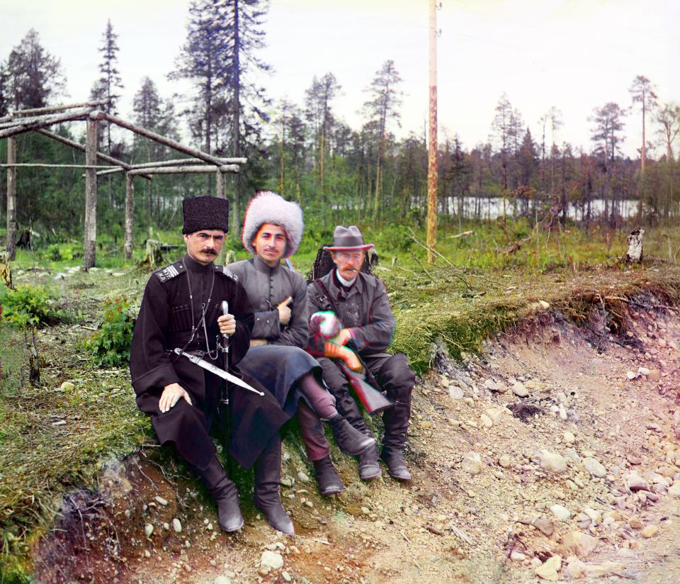  Pictured here in with two men in Cossack dress on the Murmansk Railway, Russian Empire, 1915.