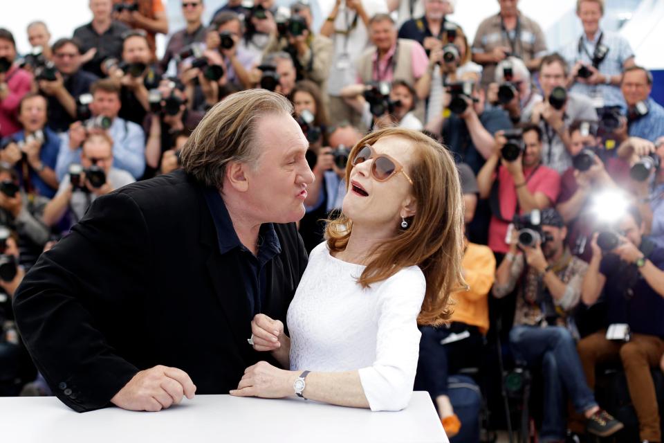  Depardieu tries to kiss kiss actress Isabelle Huppert during a photo call in Cannes