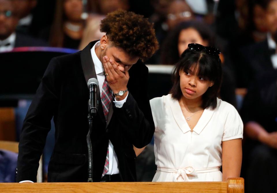  Aretha's grandson Jordan Franklin, left, pauses alongside his sister Victorie Franklin while paying tribute to their grandmother