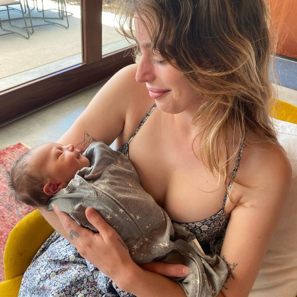  Clara shared an adorable picture on Instagram where she can be seen cradling the newest addition to her family