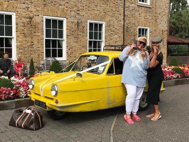  The friends showed off their fun side as they posed with a Del Boy car they came across during filming