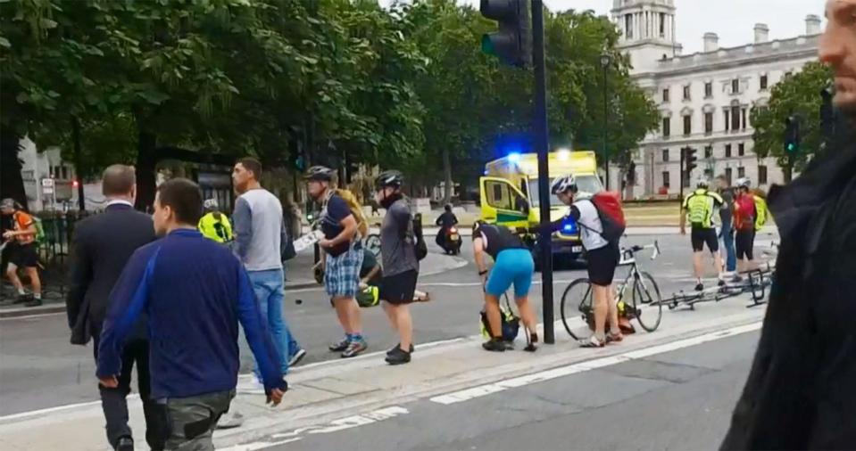  One person could be seen lying on the road as worried cyclists stood on the pavement