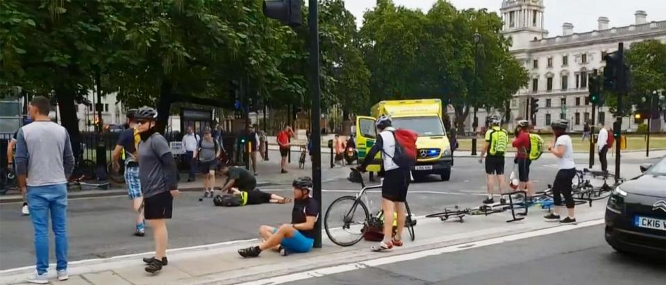  Cyclists could be seen lying on the ground after being caught up in the crash this morning