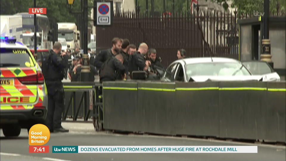  Police surround the vehicle outside the Houses of Parliament this morning