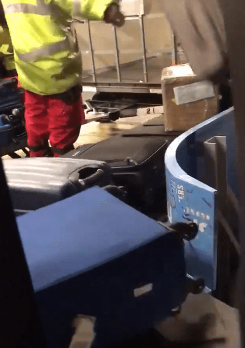  This is the moment baggage handlers at Manchester Airport mindlessly throw luggage