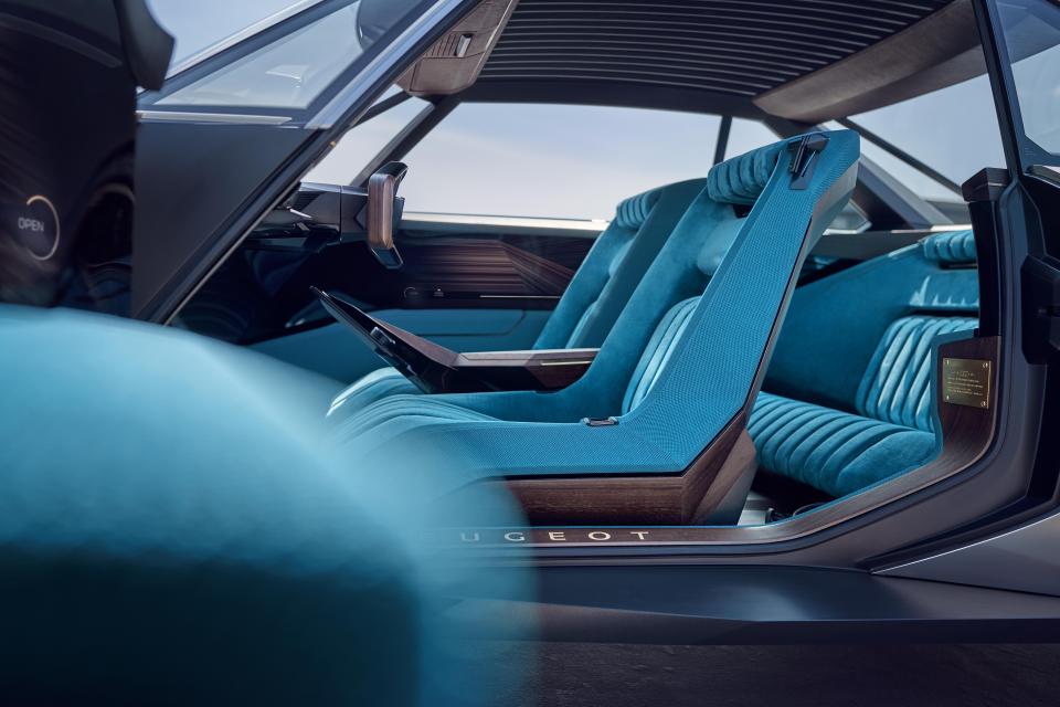  The interior keeps a retro theme with velvet seats and wooden details