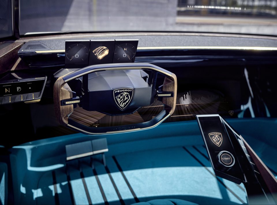  The steering wheel retracts in driverless mode, and basic controls on the seat can then be used