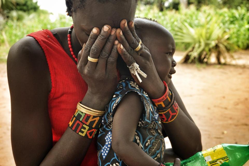  This woman fled with her baby from her village in Leer county when government forces attacked her village