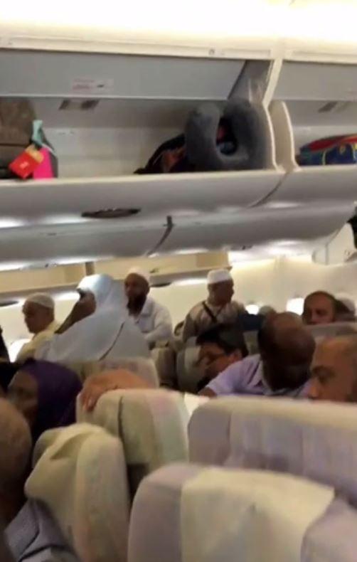  In a clip posted on social media, passengers can be seen inside the flight