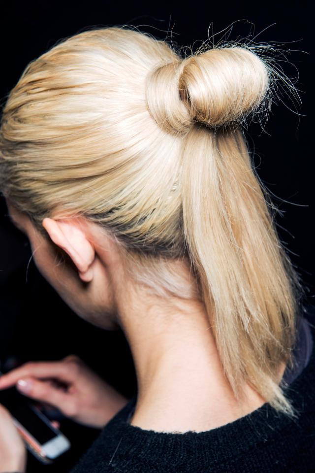  Ditch tired ponytails and topknots and get creative by crossing it with a bun