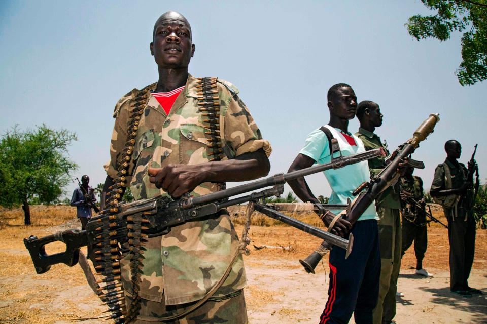  Opposition forces display their weapons near their base in Thonyor, Leer county